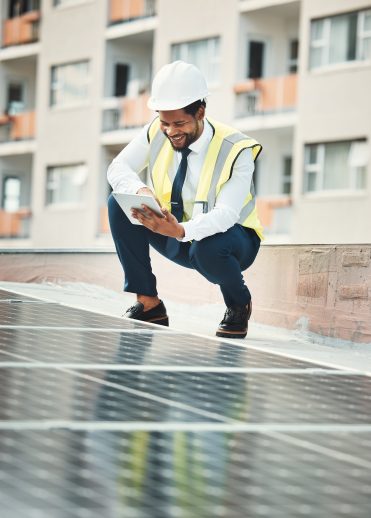 Solar panels, engineering and black man with tablet for renewable energy, maintenance and inspectio